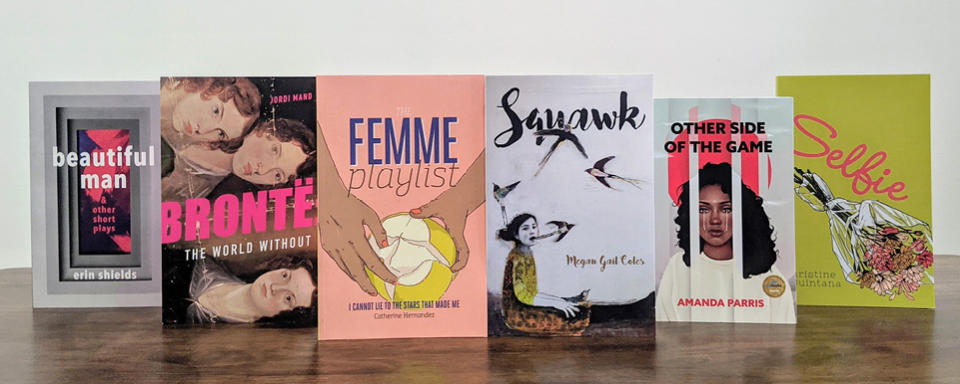 Six books by women standing on a table