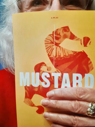 Catherine Banks holds a copy of Mustard