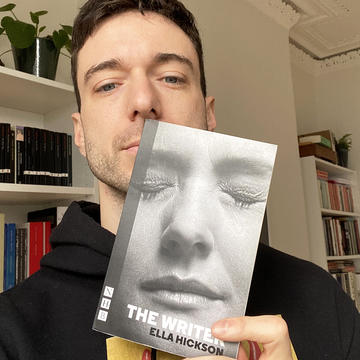 Jordan Tannahill holds a copy of The Writer